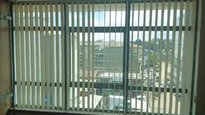 Opened Plain Yellow Sunlight Control Vertical Office Blinds