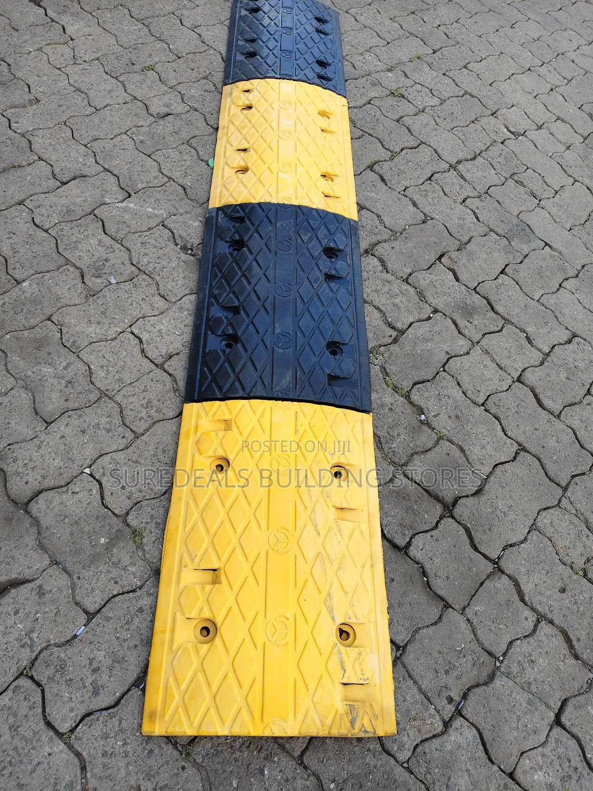 Rubber Speed Bump or Hump Used for Traffic Calming.