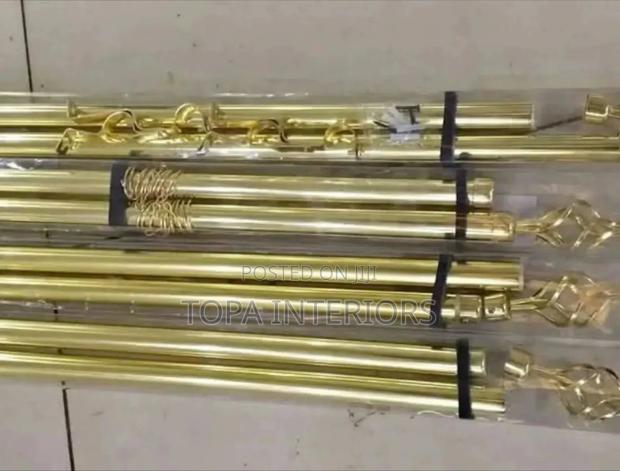 Gold Curtain Rods That Adjust Depending on the Size of the Window