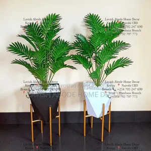 Decorative Artificial Fern Plant in a Hexagon Vase With a Gold Stand