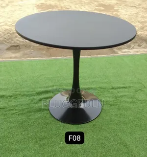 Wooden Tulip Pedestal Dining Table .