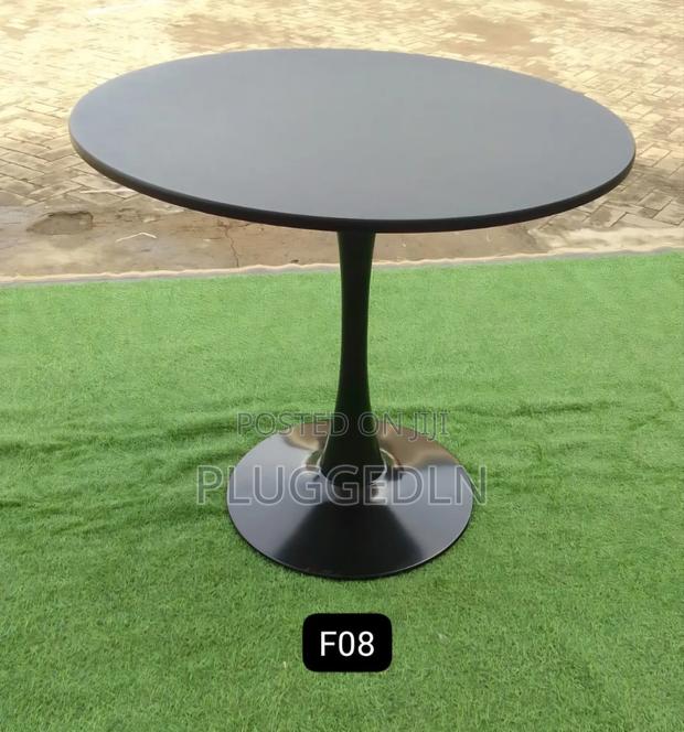 Wooden Tulip Pedestal Dining Table .