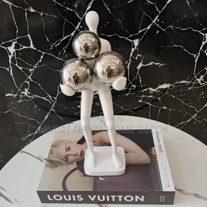 Decorative Human Figurine With Balls .