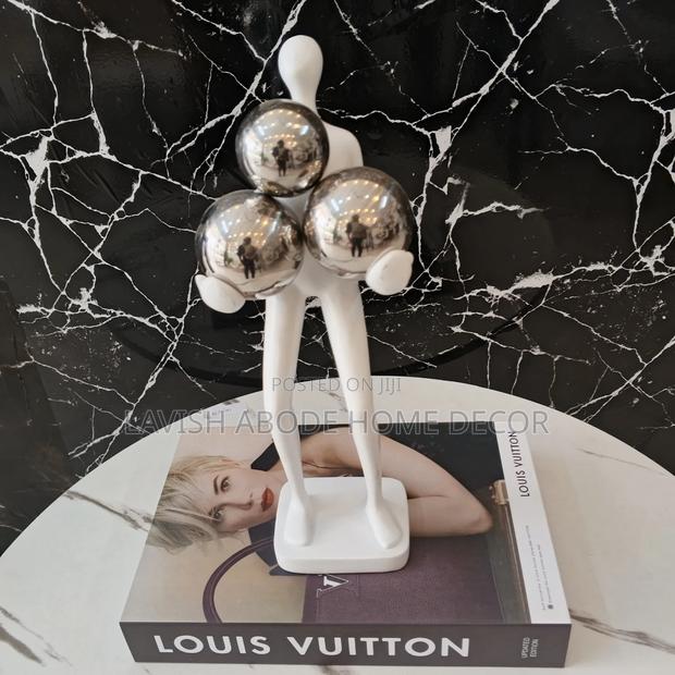 Decorative Human Figurine With Balls .