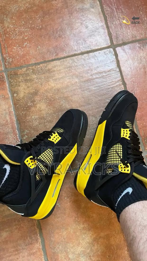Air Jordan 4 Thunder Yellow Sneakers - main view
