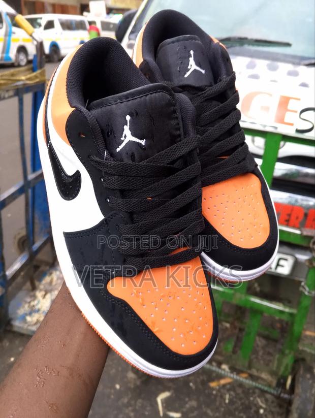 Jordan 1 Low Cut Orange Sneakers – Trendy Streetwear Shoes Kenya