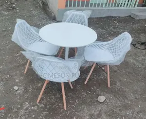 All White Round Eames Table and White Eames Chairs
