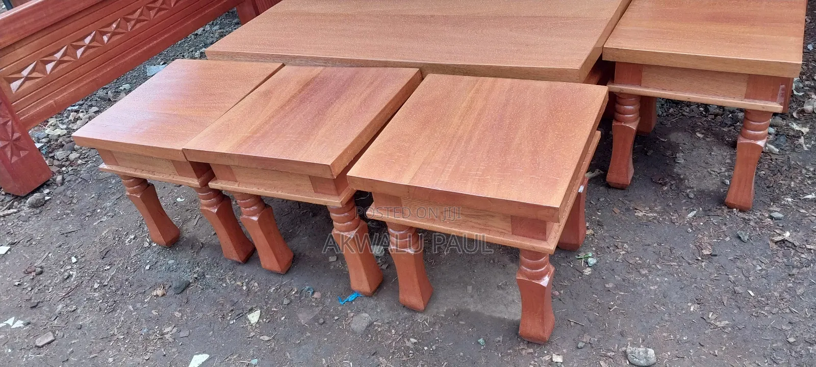 A Set Of Coffee Table And Four Stools