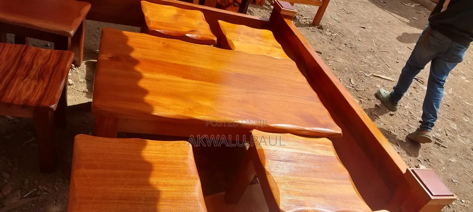 A Set Of Coffee Table And Four Stools