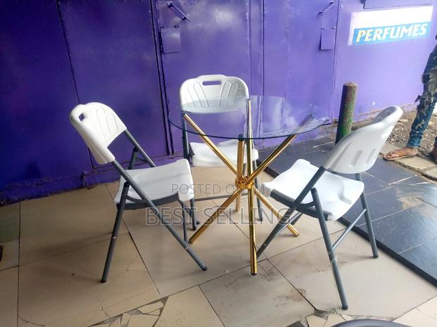 Gold Stands Round Table and Folderble Chairs - main view