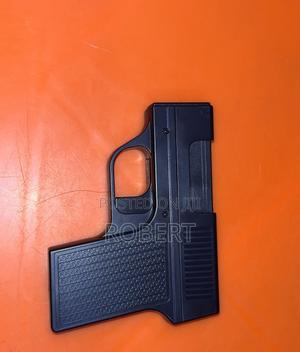 Gun-Shaped Butane Lighter That Doubles as a Cigarette Storage Case. - thumbnail 2