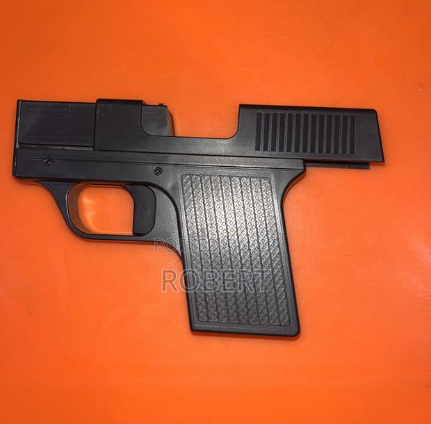 Gun-Shaped Butane Lighter That Doubles as a Cigarette Storage Case. - thumbnail 3