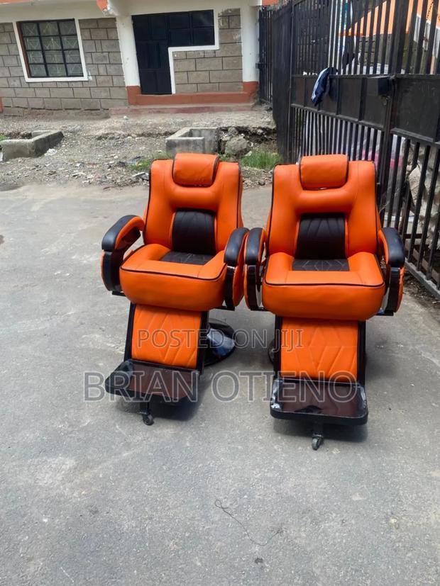 Adjustable Orange Kinyozi Chairs - main view