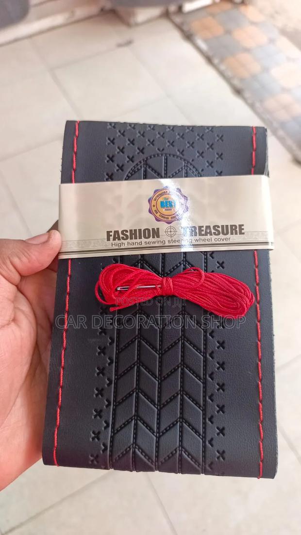Black Hand Sewing Steering Wheel Cover With Red Thread and Needle