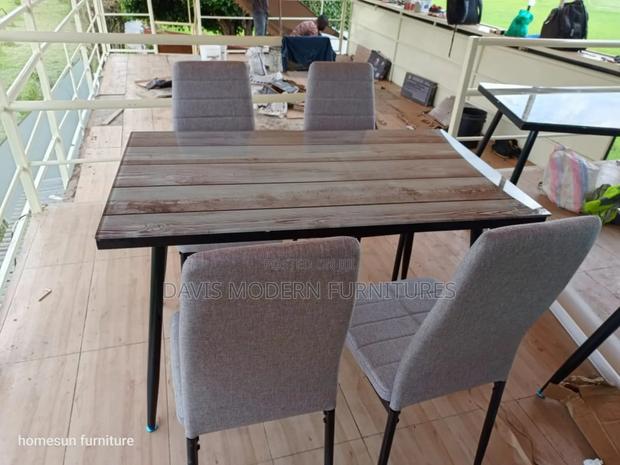 Dinning Table With Gray Upholstered Chair