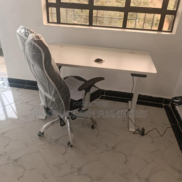 White Rectangular Office Desk With a Matching Chair