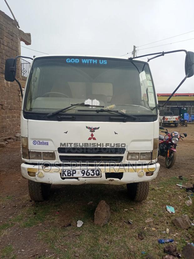 A Well Used Mitsubishi Dump Truck - thumbnail 4