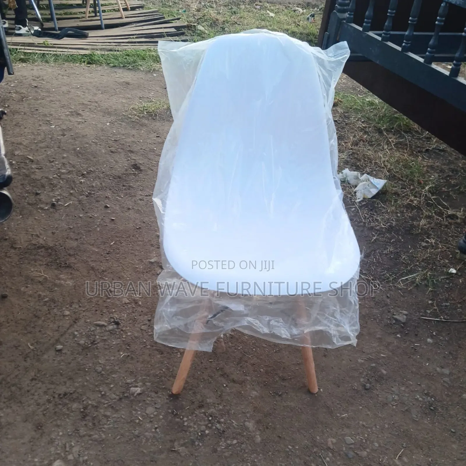 White Plastic Eams Chairs