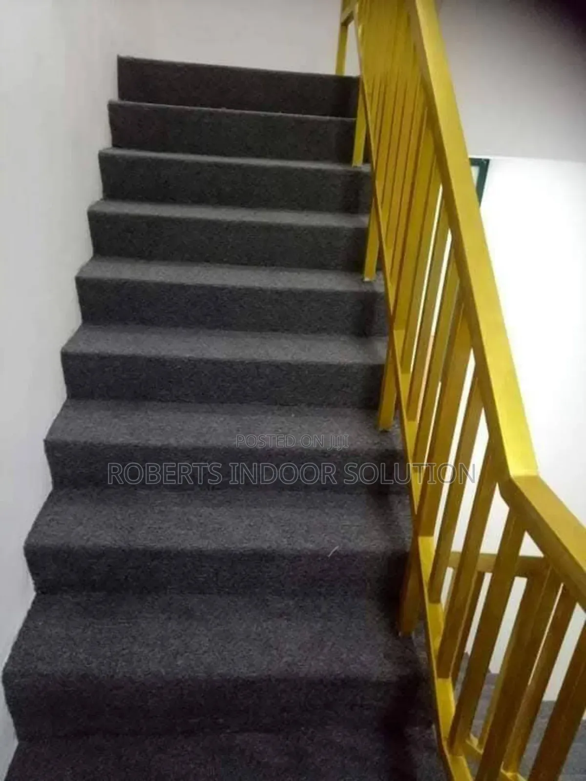 Staircase With Dark Gray Wall-to-Wall Carpet