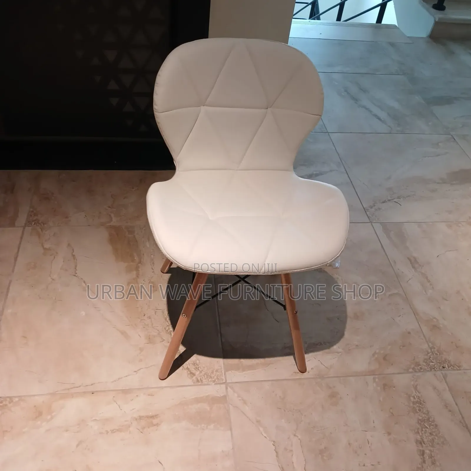 White Padded Eams Chairs