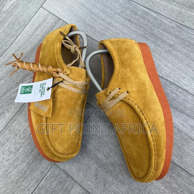 Yellow Hairy Suede Shoes Are the Clarks Originals Wallabee,