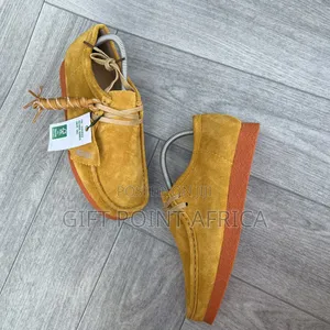 Yellow Hairy Suede Shoes Are the Clarks Originals Wallabee,