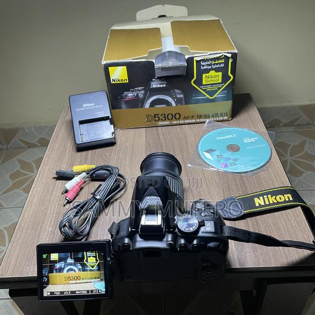 Nikon D5300 DSLR Camera (24mp, Wifi, Flip Screen) + 18–55mm Lens