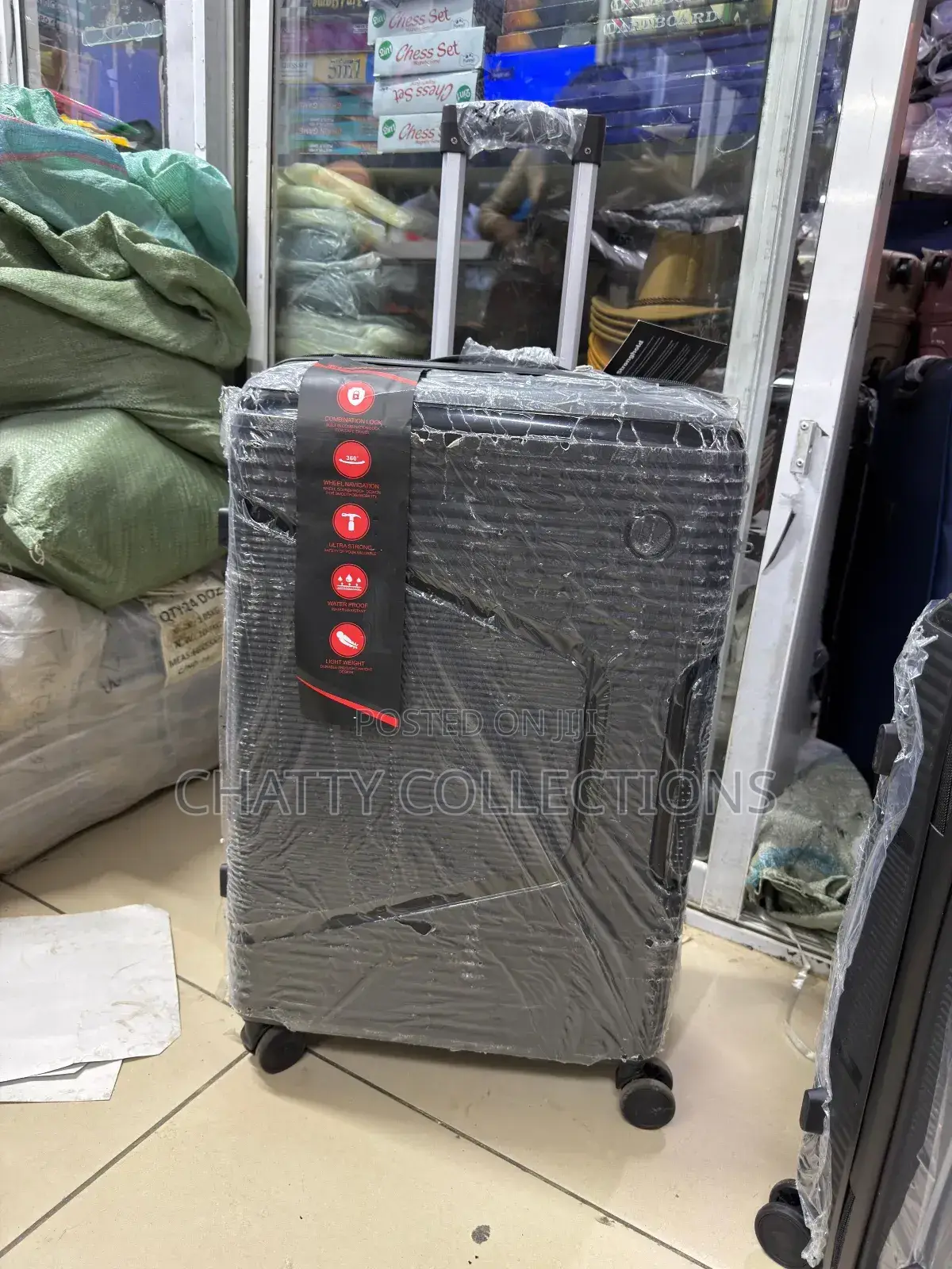 Black Large Rubber Suitcase 
Height 63cm
Capacity 23kgs)