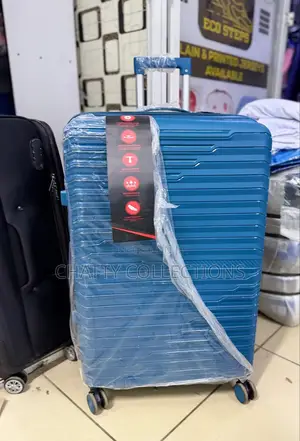 Turquoise Xl Rubber Suitcase 
Height 75cm (Capacity 32kgs)
