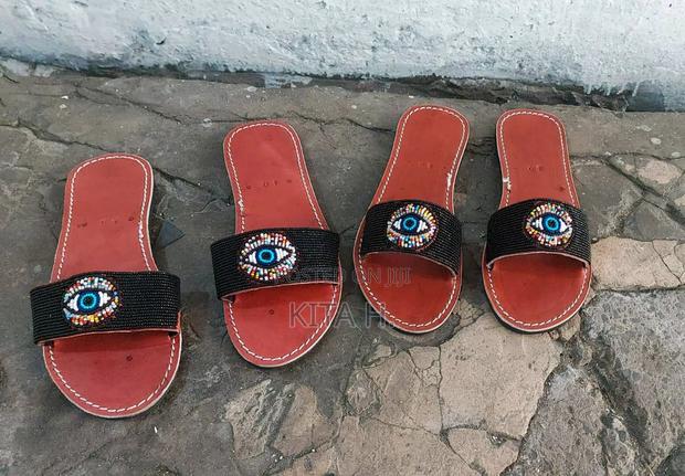 Leather Beaded Slippers.