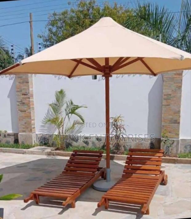Wooden Foldable Sunbeds and a Parasol - main view