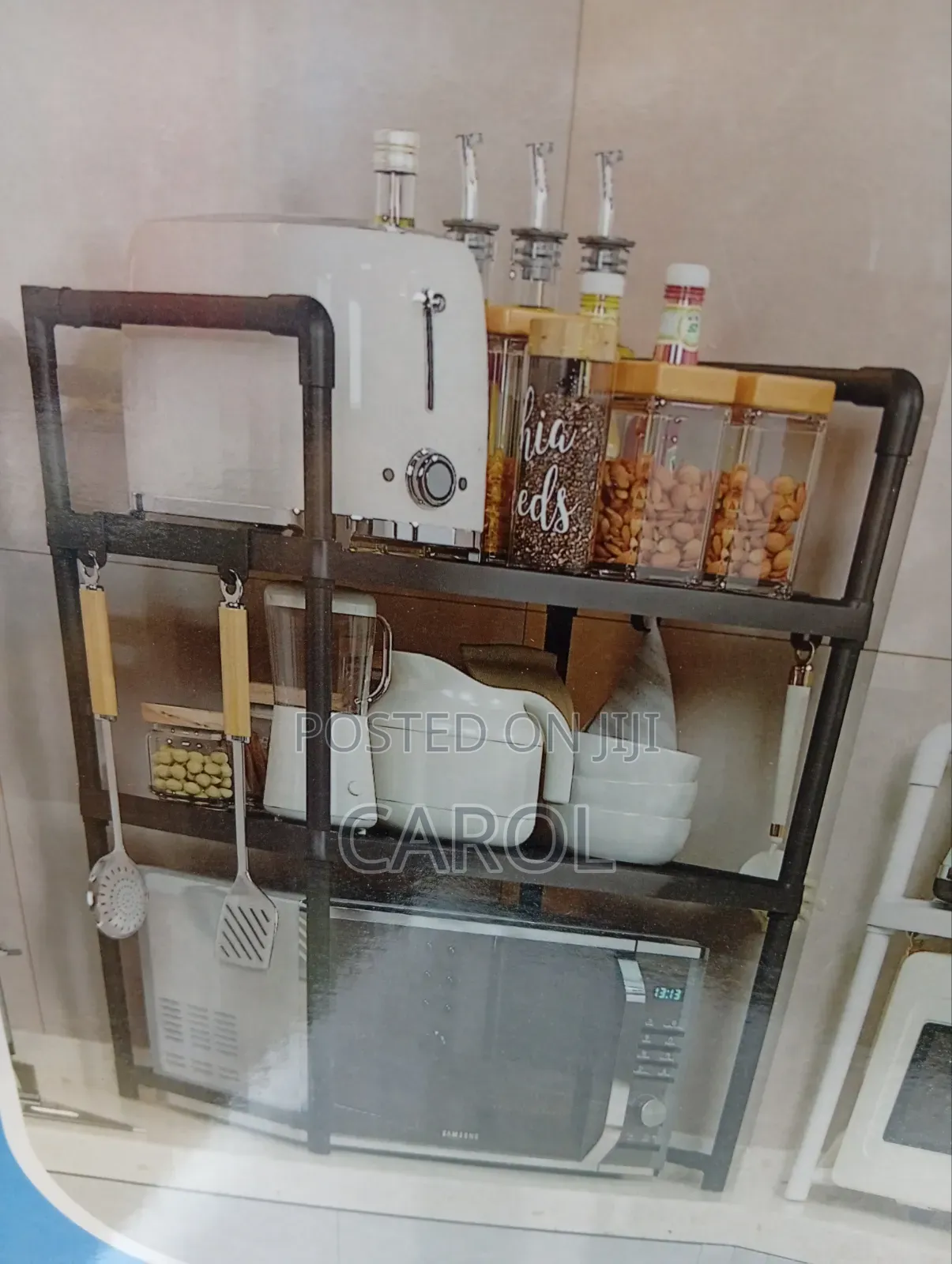 A Black Microwave Oven Storage Rack