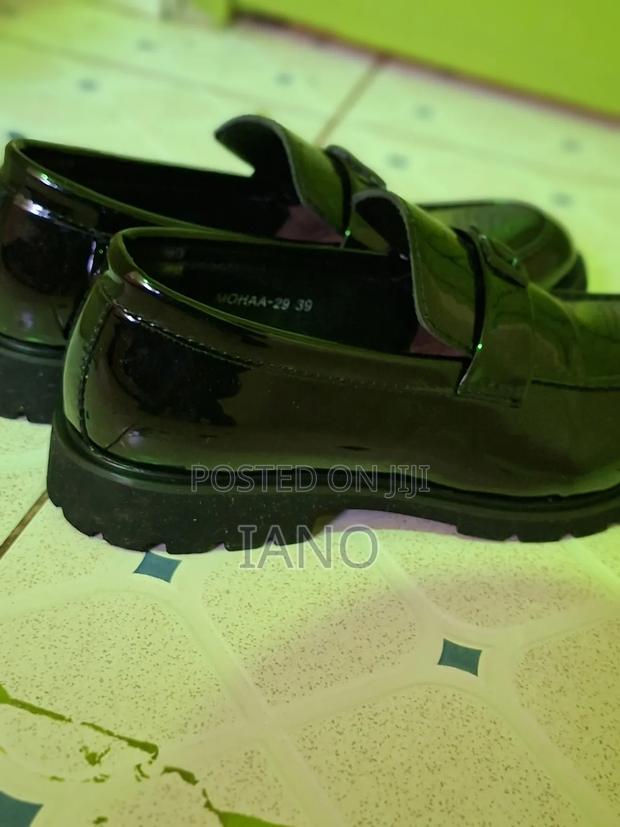 
These Black Slip-on Shoes Are Empire Wetlook.