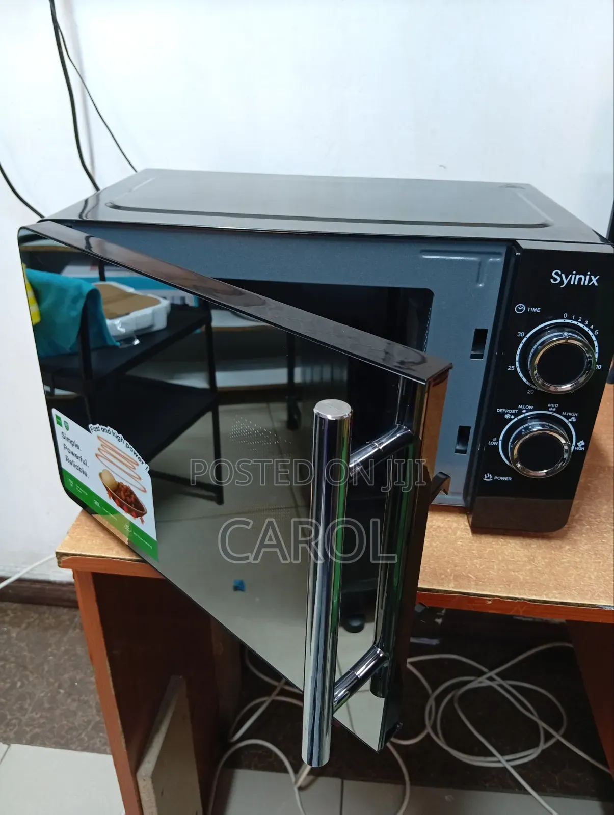 Black Manual Syinix Microwave at 7,299