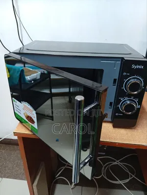 Black Manual Syinix Microwave at 7,299
