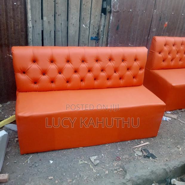 Orange Couches With Black Buttons - main view