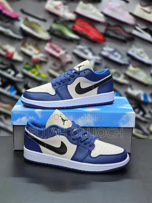 Nike Air Jordan 1 Low in a French Blue and College Grey Colorway.
