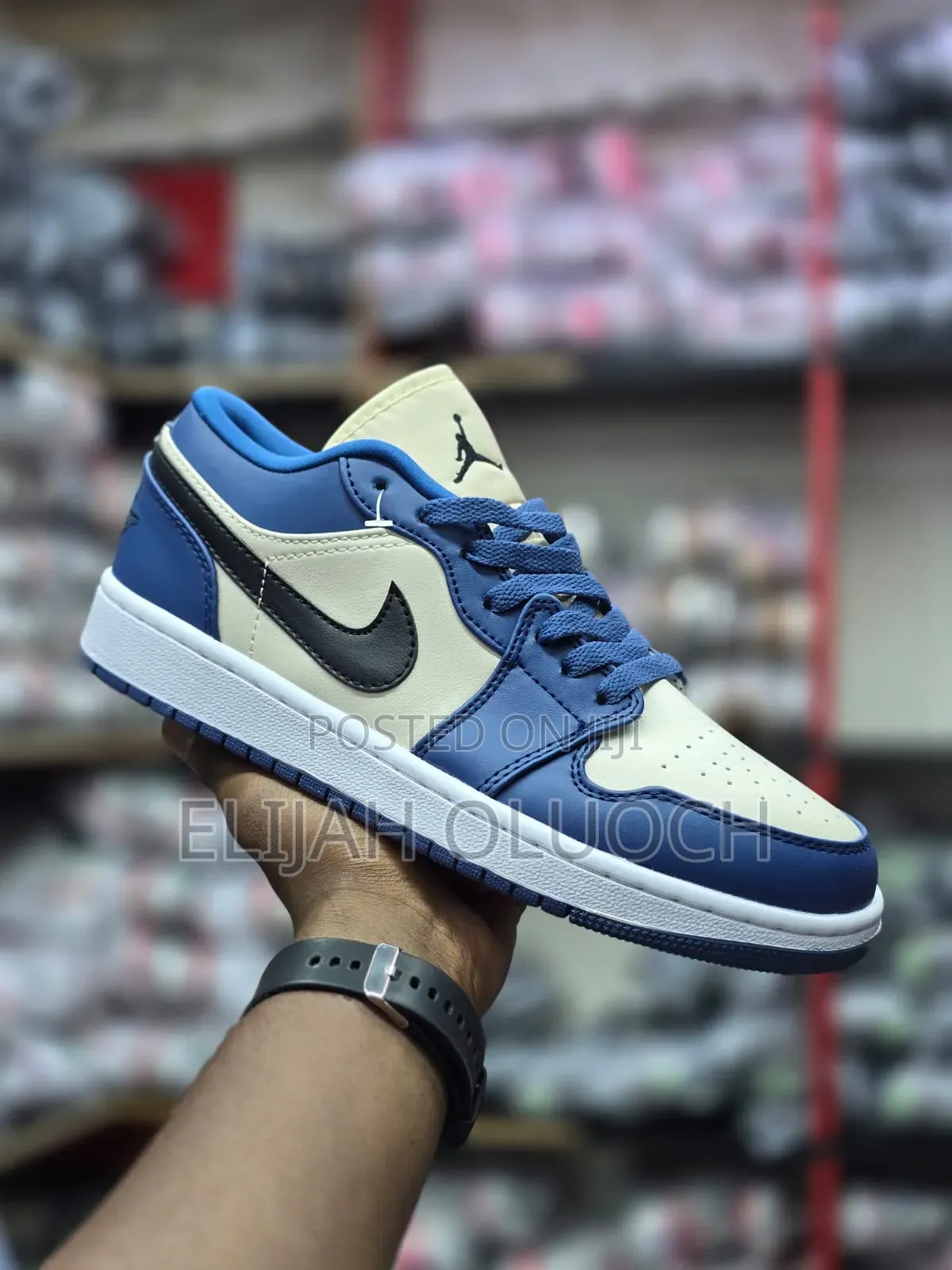 Nike Air Jordan 1 Low in a French Blue and College Grey Colorway.
