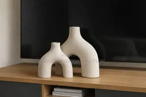 Global Views Stretch Vase in Cream Stone.