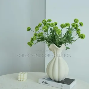 White Petal Vase Containing Artificial Green Pompom Dahlia Flowers.