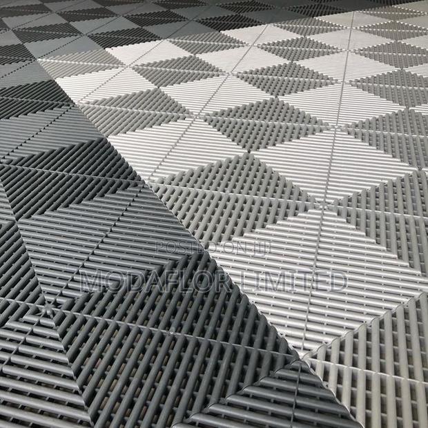Garage Floor Tiles for Clean, Strong and Modern Floor Finishing
