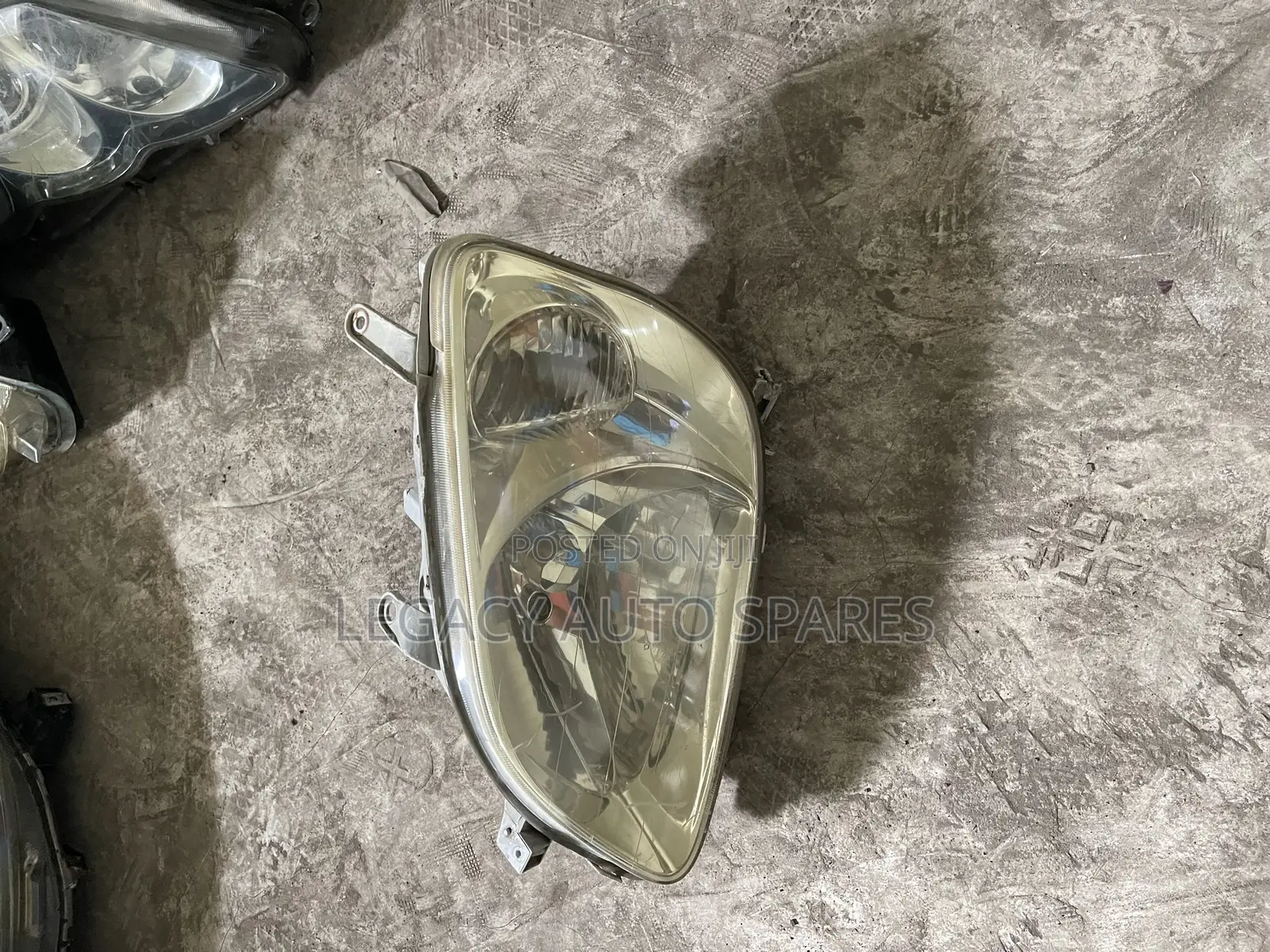Toyota Raum Headlight