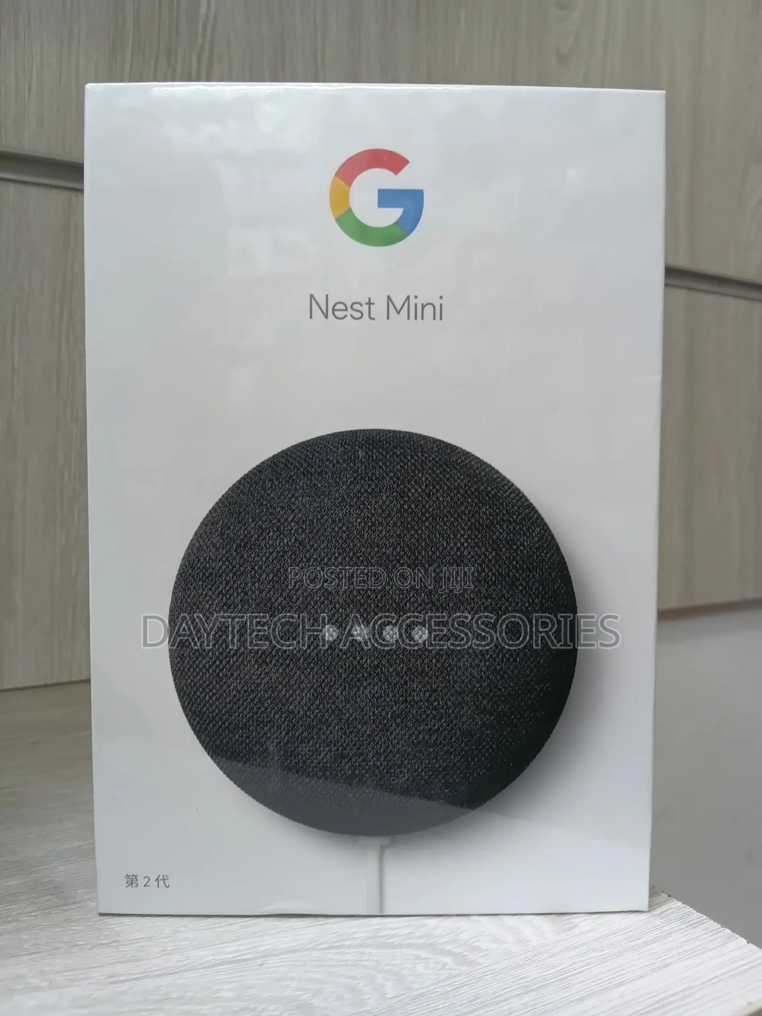 This Is a Google Nest Mini (2nd Generation) Smart Speaker in Charcoal.