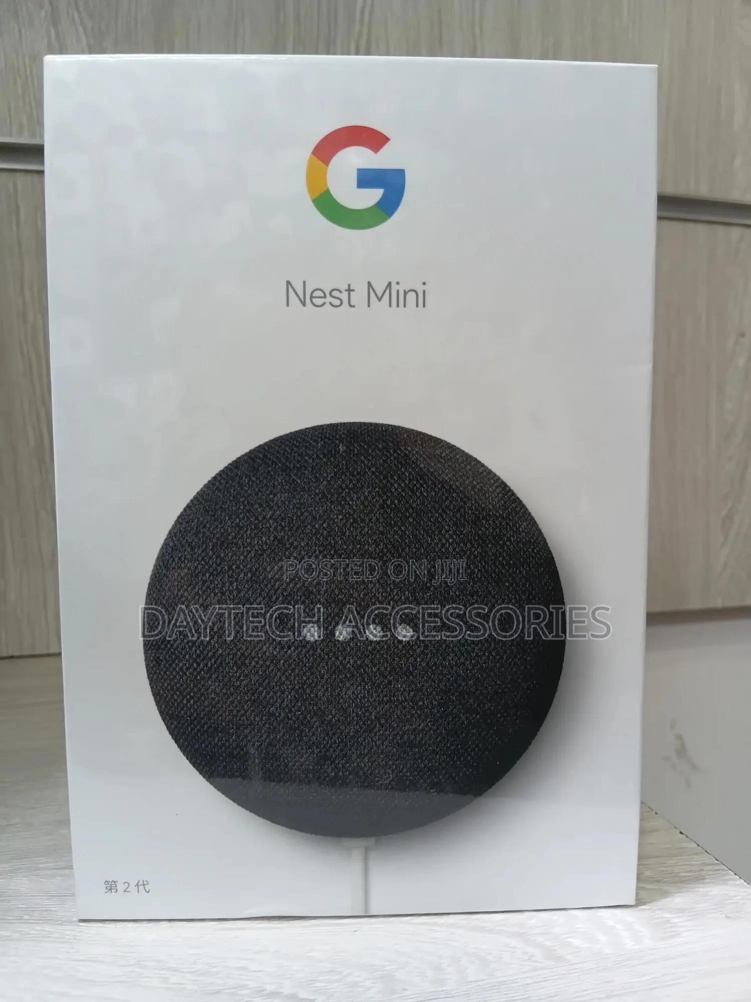 This Is a Google Nest Mini (2nd Generation) Smart Speaker in Charcoal.