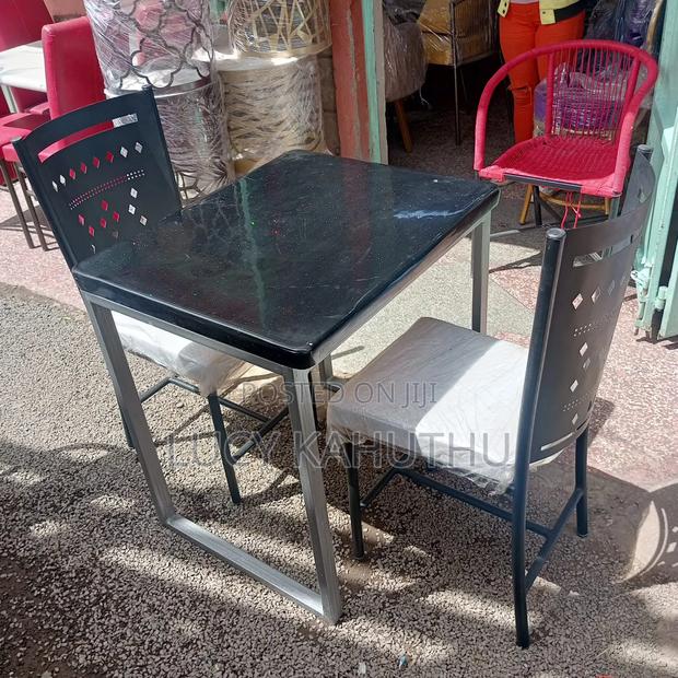 Grey Marble Top With Mabati Laser Cut Chairs