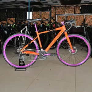 Ride Fast in Style – Senidas 26” Orange Road Bike