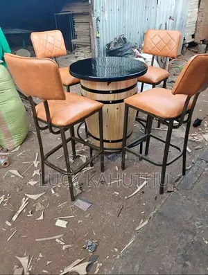 Barrel Table With Brown High Stools Chairs