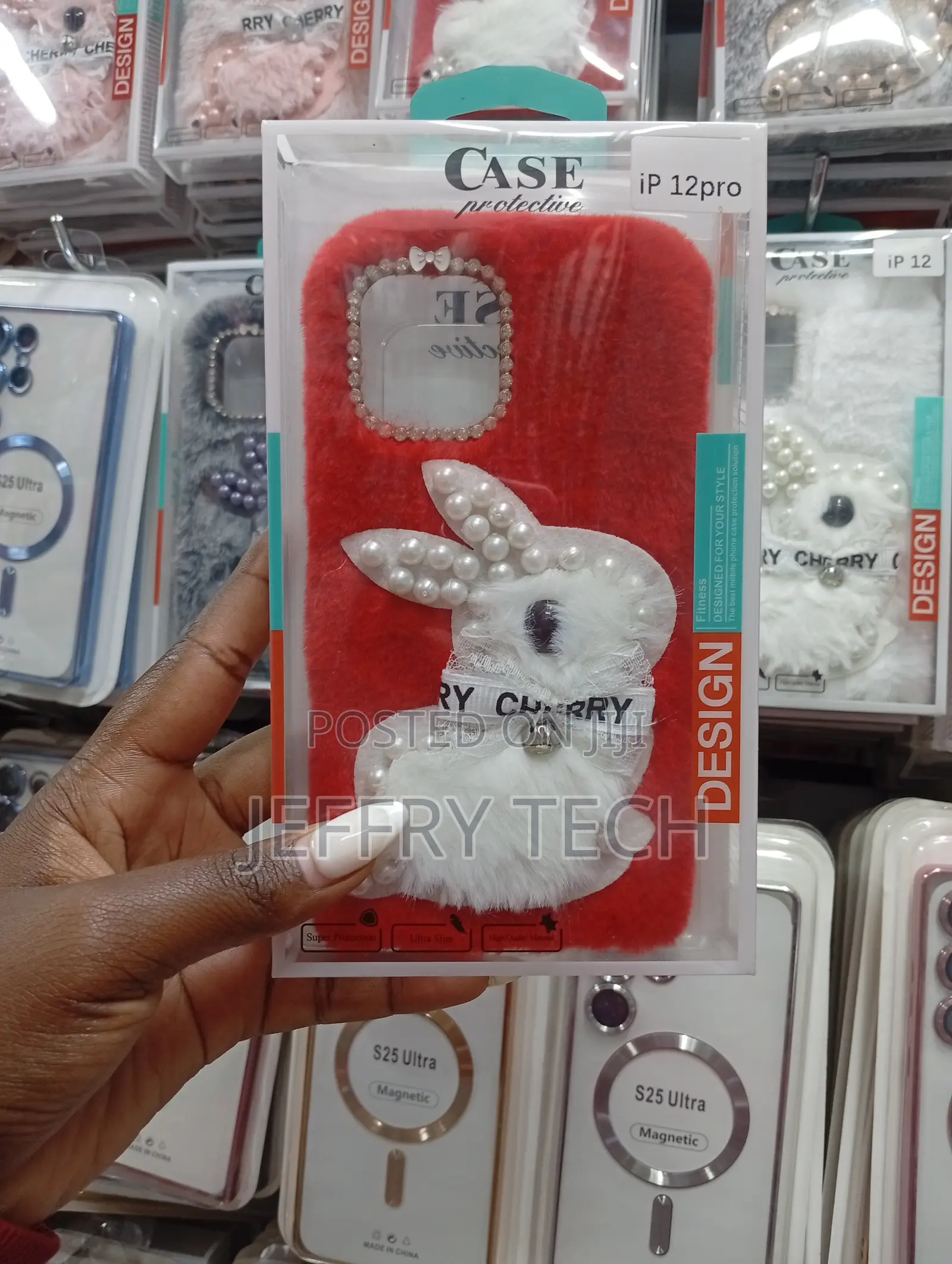 iPhone 12 Pro Red Furrywith a White Plush Bunny Adorned With Pearls.