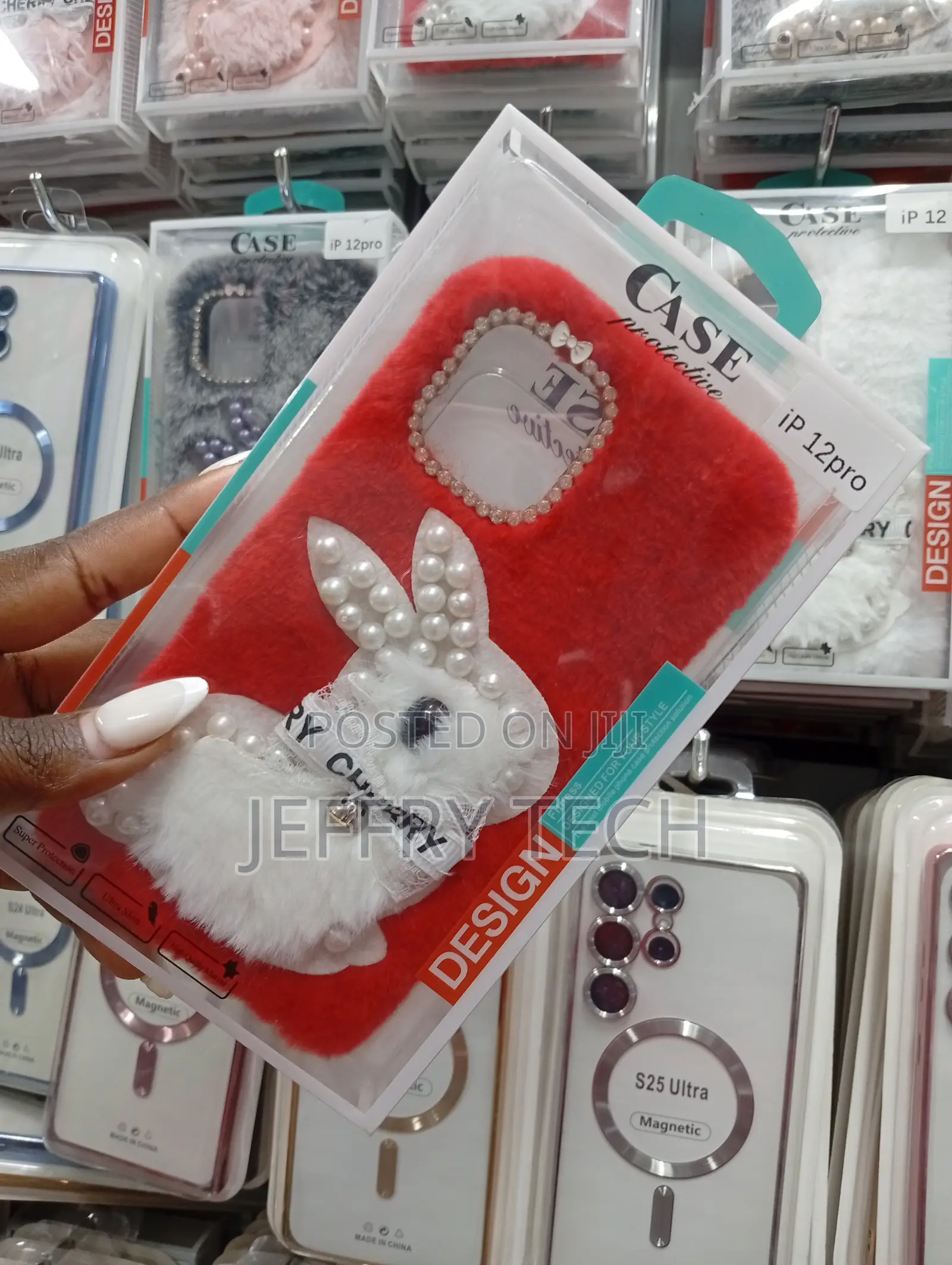 iPhone 12 Pro Red Furrywith a White Plush Bunny Adorned With Pearls.