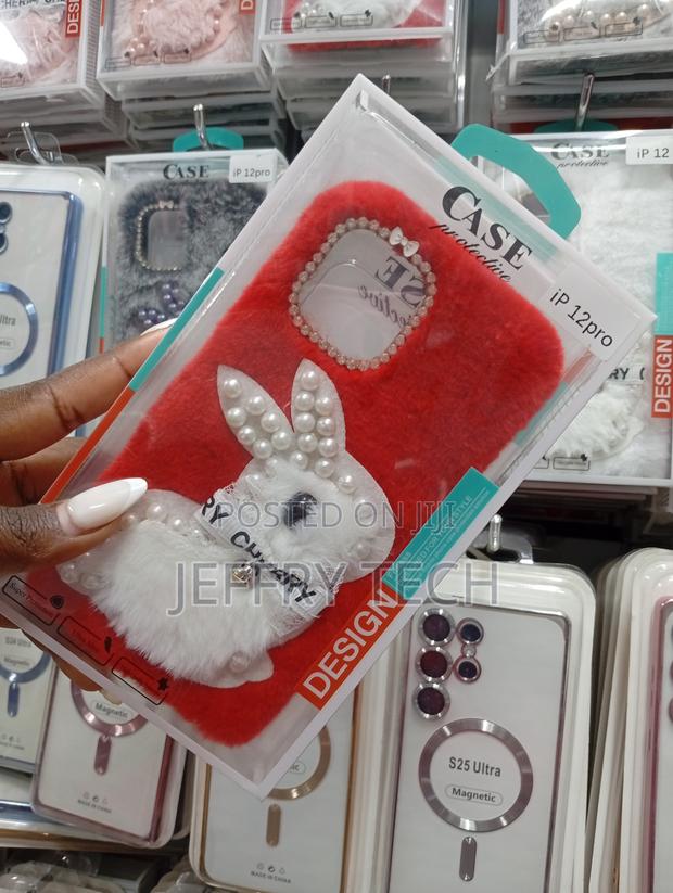 iPhone 12 Pro Red Furrywith a White Plush Bunny Adorned With Pearls. - thumbnail 2